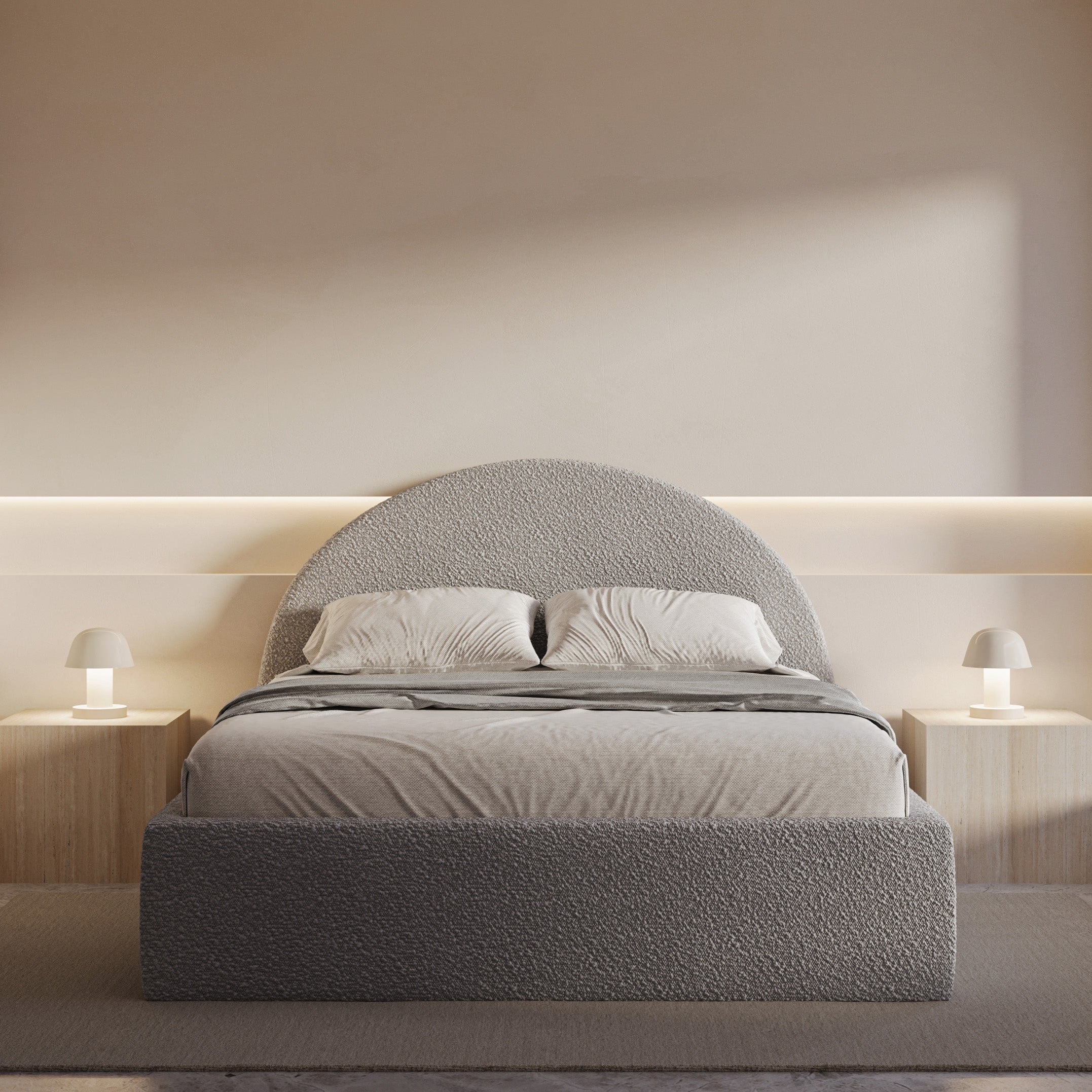 Modern bedroom with a gray upholstered bed and minimal decor.
