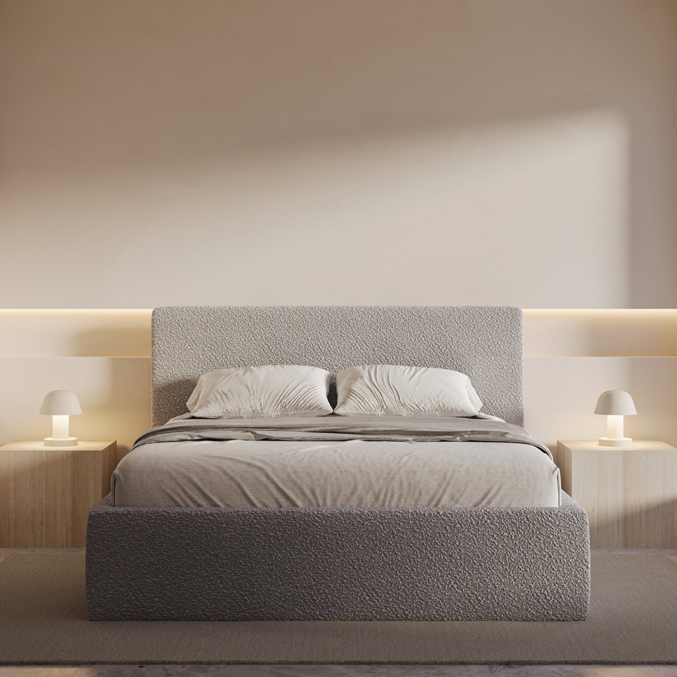 Modern bedroom with a gray upholstered bed, nightstands, and wall lighting.