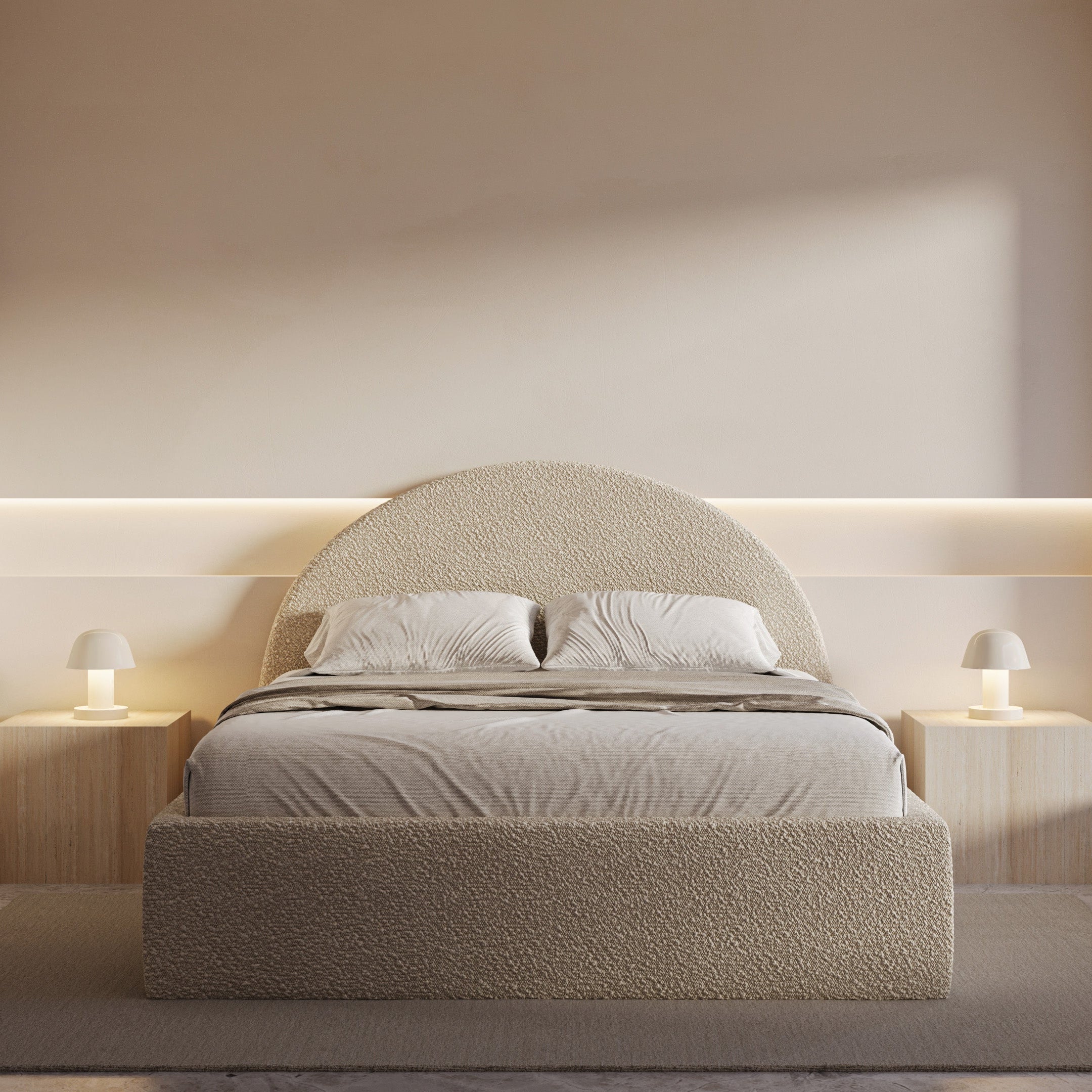 Modern bedroom with a beige upholstered bed and headboard lighting.